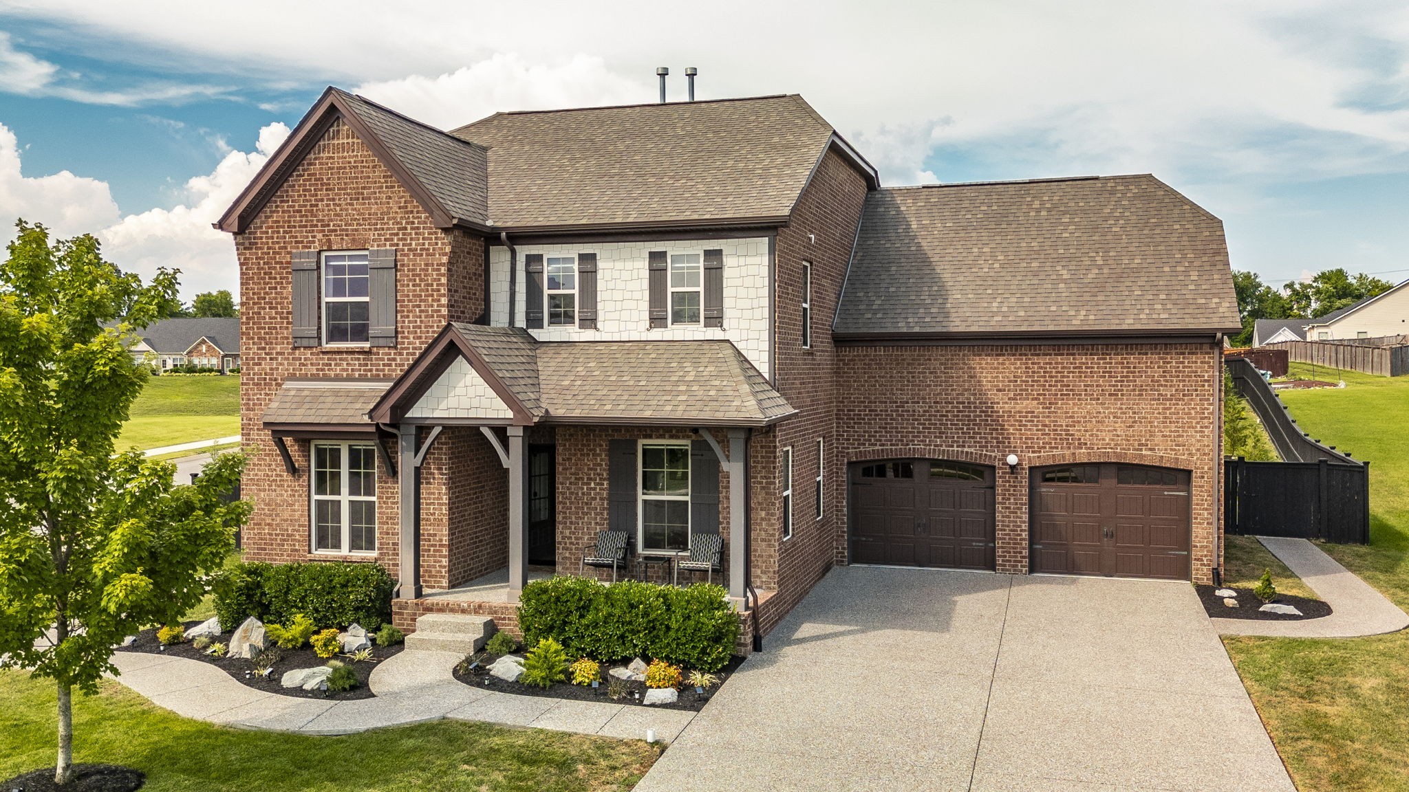 a front view of a house with yard