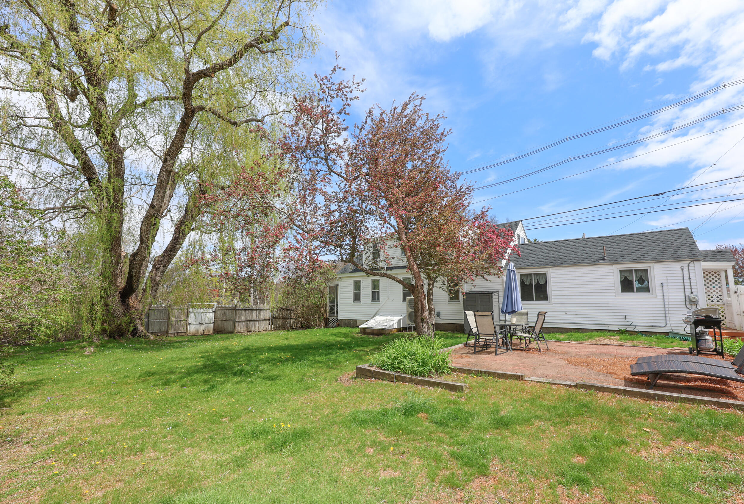 144 Post Road Wells, ME 04090 - Photo 34 of 48 Back w:yard & Patio