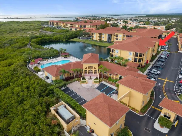 an aerial view of a house with a lake view