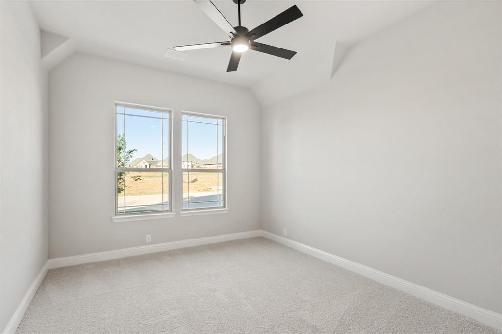 34 Osprey Street Joshua, TX 76058 - Photo 28 of 36 an empty room with a window and a fan