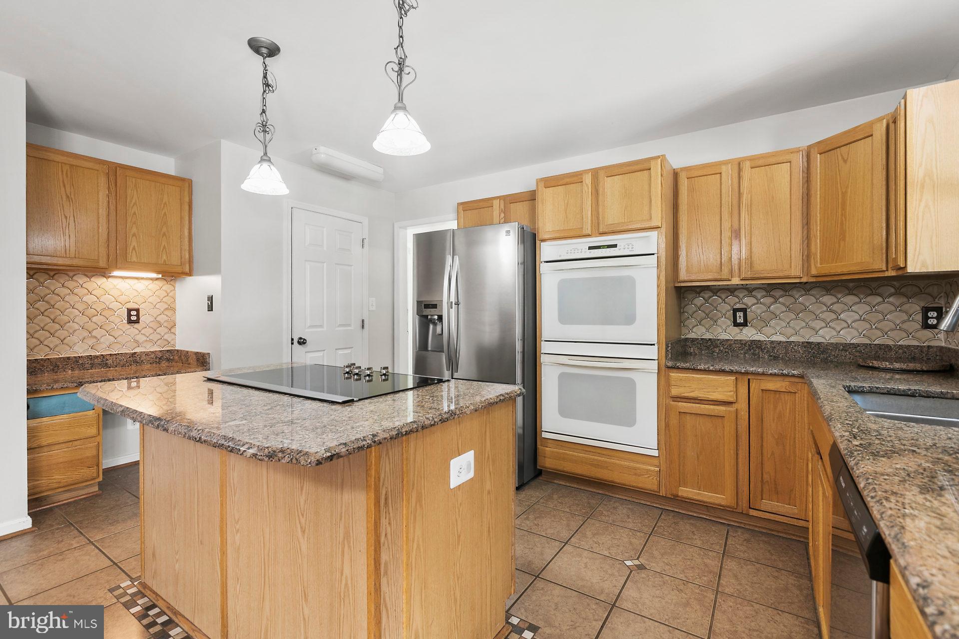 1837 Lottie Fowler Road Prince Frederick, MD 20678 - Photo 21 of 43 Double Ovens and Breakfast Bar Seating