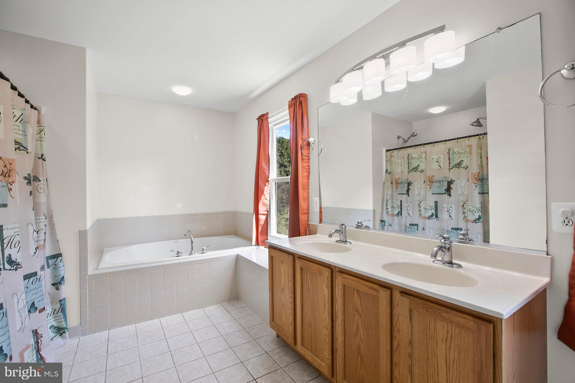 1837 Lottie Fowler Road Prince Frederick, MD 20678 - Photo 29 of 43 Master Bath w Double Sinks and a Large Soaking Tub