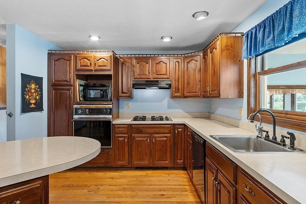 176 Ellis Road Westminster, MA 01473 - Photo 12 of 42 a kitchen with stainless steel appliances granite countertop a sink stove and refrigerator