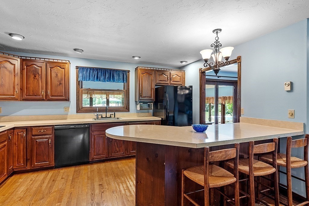 176 Ellis Road Westminster, MA 01473 - Photo 13 of 42 a large kitchen with a table and chairs