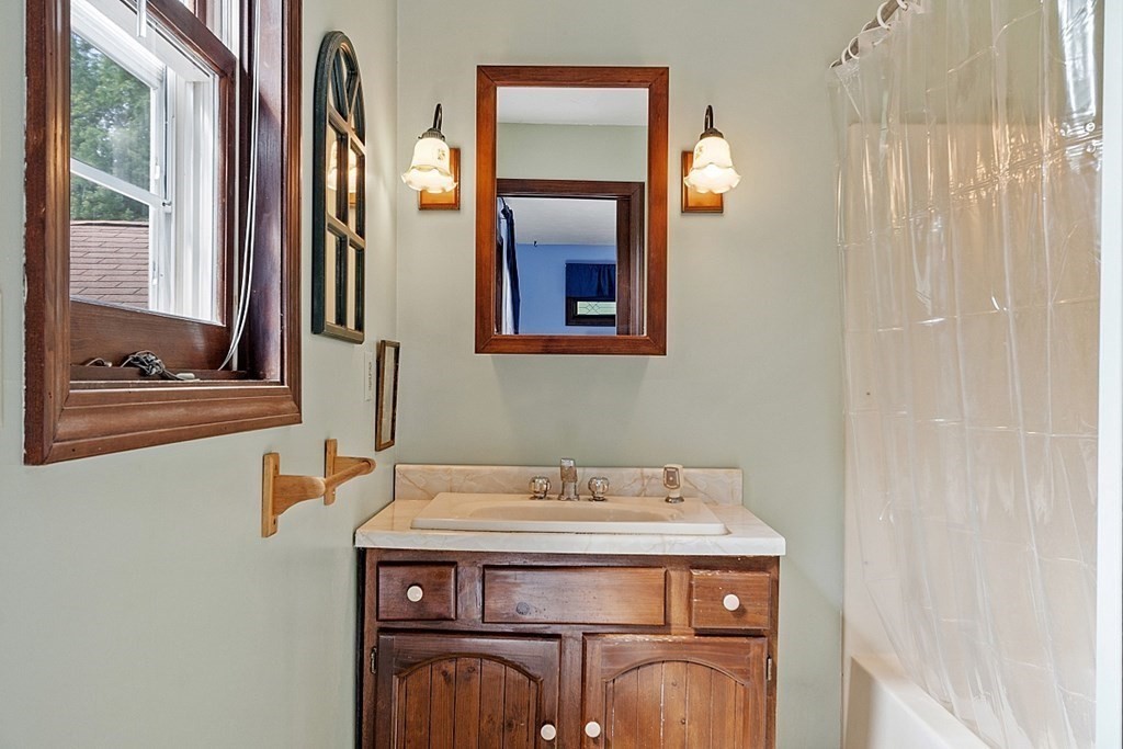 176 Ellis Road Westminster, MA 01473 - Photo 18 of 42 a view of a bathroom with a sink and a mirror