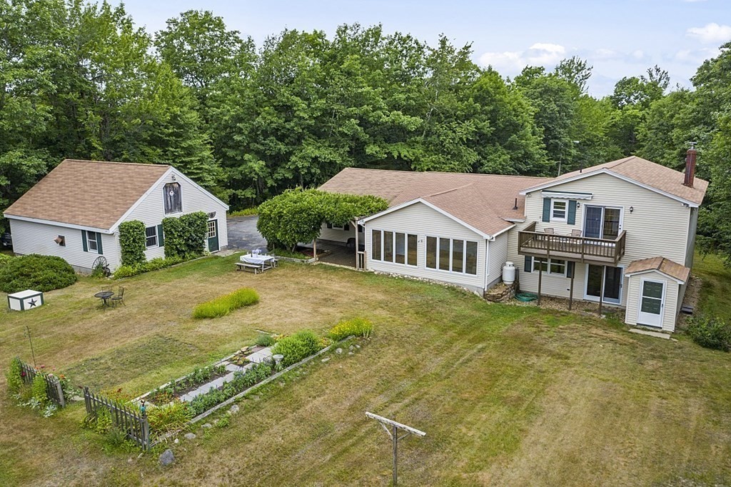 176 Ellis Road Westminster, MA 01473 - Photo 2 of 42 a view of house with garden space and trees in the background