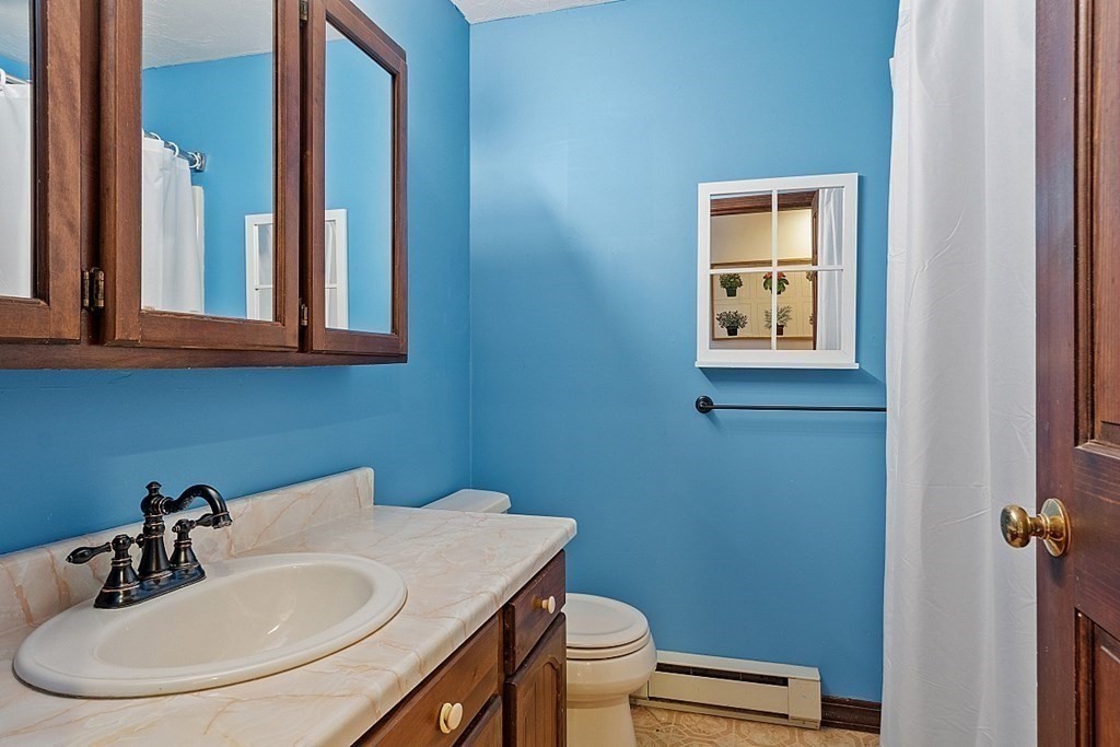 176 Ellis Road Westminster, MA 01473 - Photo 24 of 42 a bathroom with a sink a toilet and a mirror