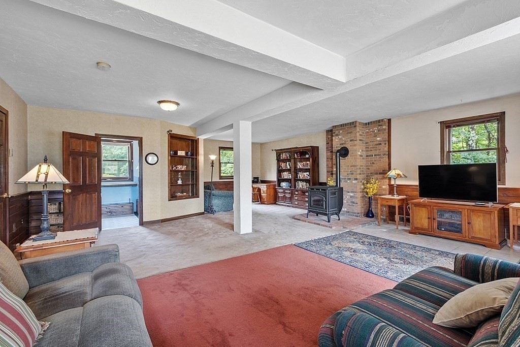 176 Ellis Road Westminster, MA 01473 - Photo 27 of 42 a living room with furniture and a flat screen tv