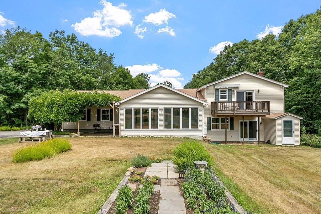 176 Ellis Road Westminster, MA 01473 - Photo 34 of 42 a front view of a house with a garden