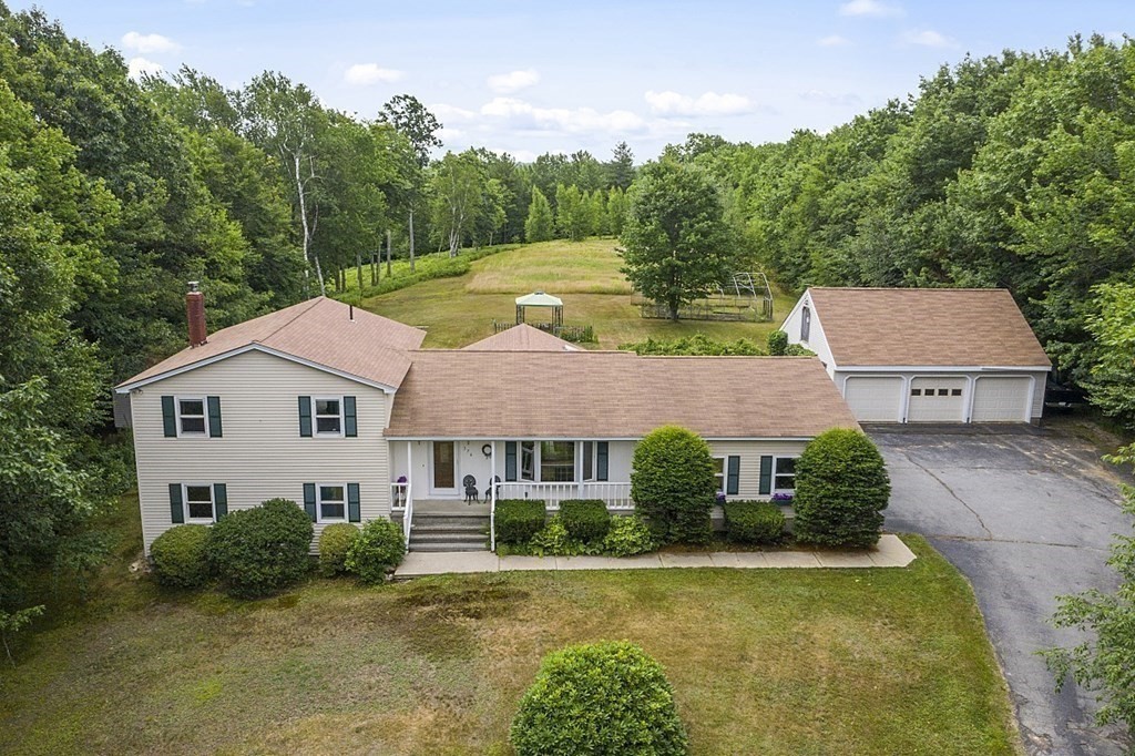 176 Ellis Road Westminster, MA 01473 - Photo 41 of 42 a aerial view of a house next to a big yard and large trees