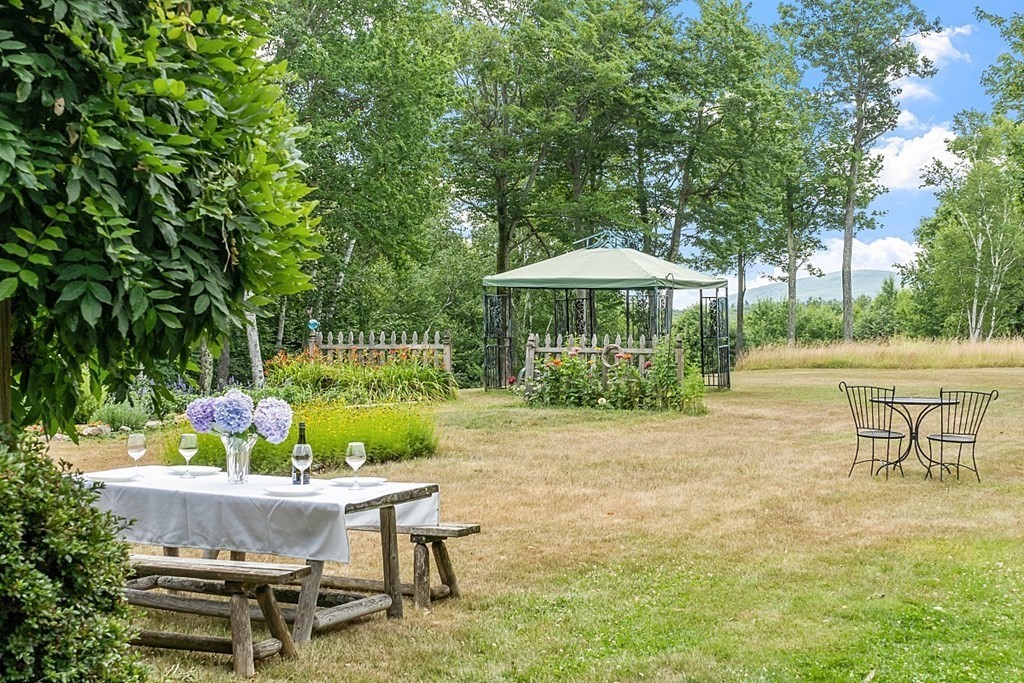 176 Ellis Road Westminster, MA 01473 - Photo 8 of 42 a backyard of a house with table and chairs