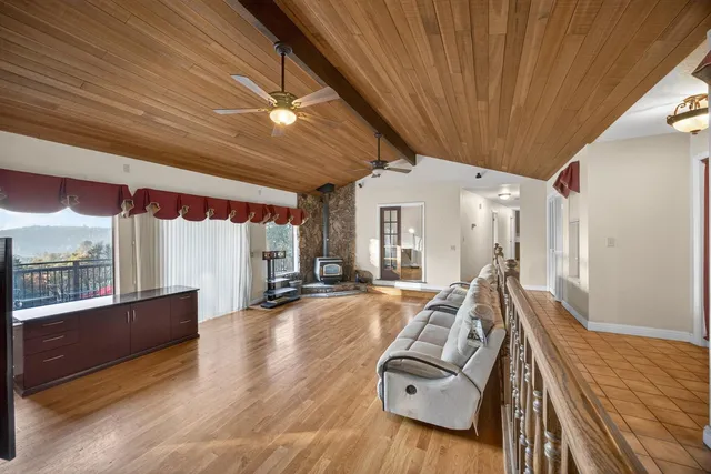 a view of a dining room with furniture wooden floor and chandelier