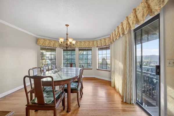 a kitchen with stainless steel appliances granite countertop a stove a refrigerator and a stove