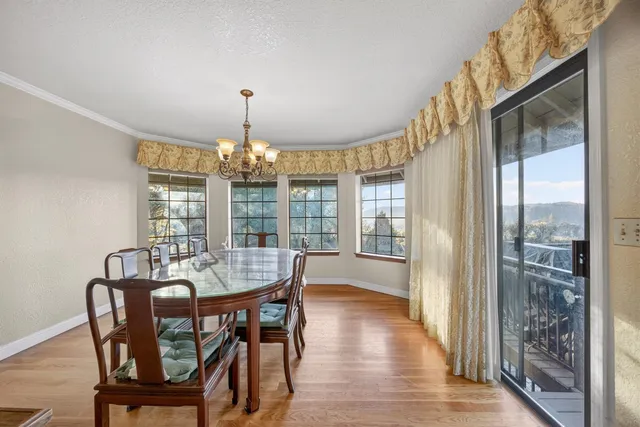 a kitchen with stainless steel appliances granite countertop a stove a refrigerator and a stove