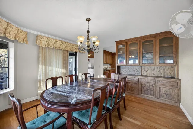 a kitchen with a sink stove top oven and cabinets
