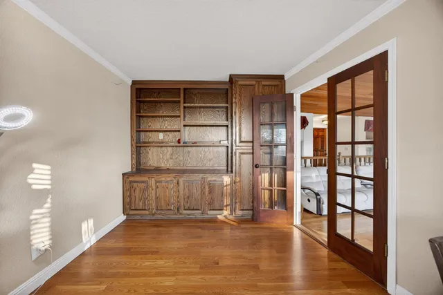 a bedroom with two beds and a closet