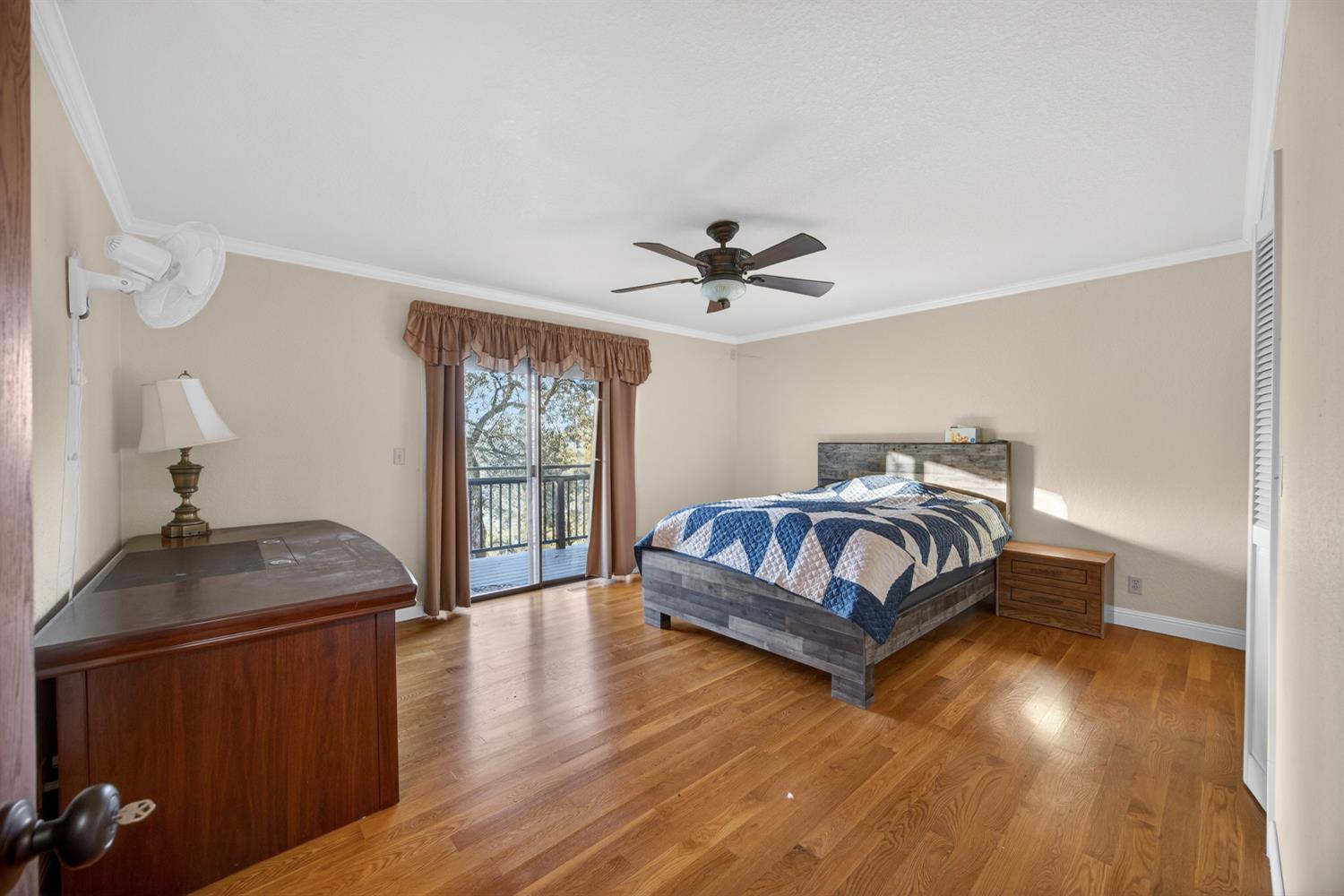 3281 Yearling Trail Placerville, CA 95667 - Photo 31 of 61 a bedroom with a bed and wooden floor