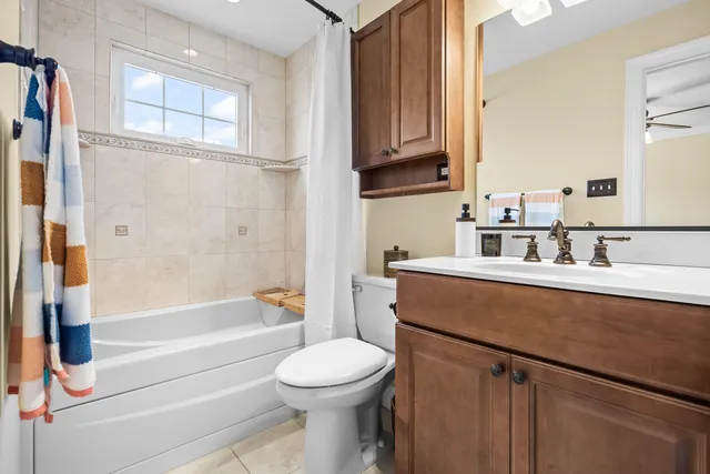 a bathroom with a sink a toilet and bathtub
