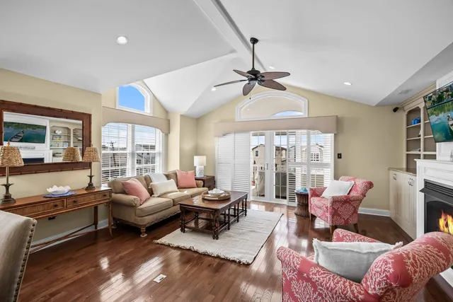 a living room with furniture ceiling fan and a rug