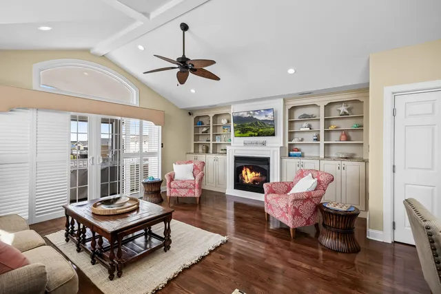 a living room with furniture a rug and a fireplace