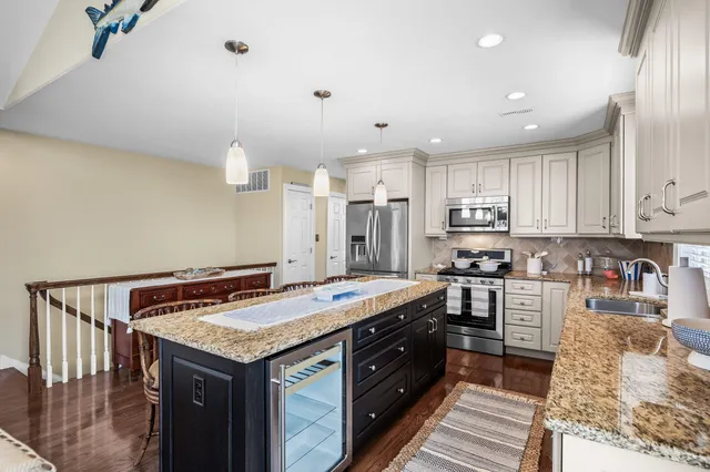 a kitchen with a stove and a refrigerator