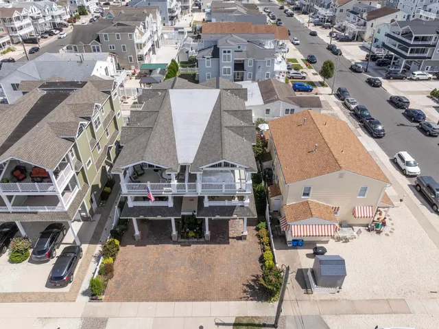 an aerial view of residential houses with outdoor space