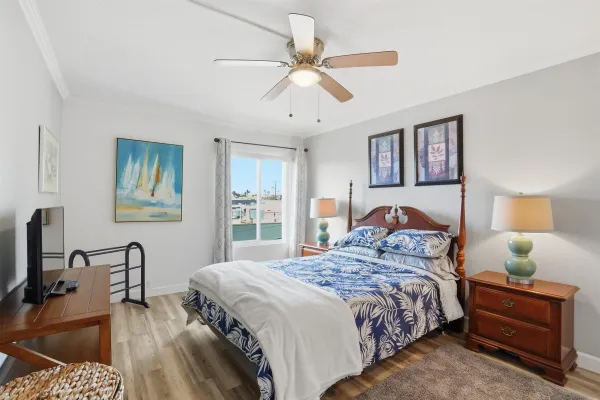 a bedroom with a bed and a table in it