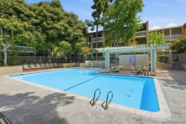 a view of a swimming pool with sitting area