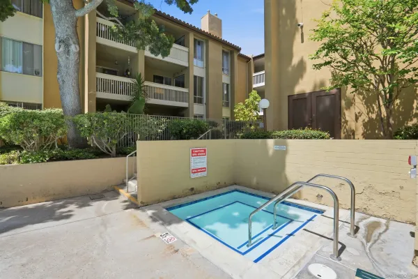 a swimming pool with outdoor seating and yard