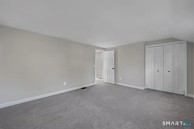 a view of an empty room and entryway