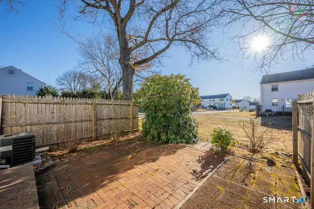 a view of a backyard of the house