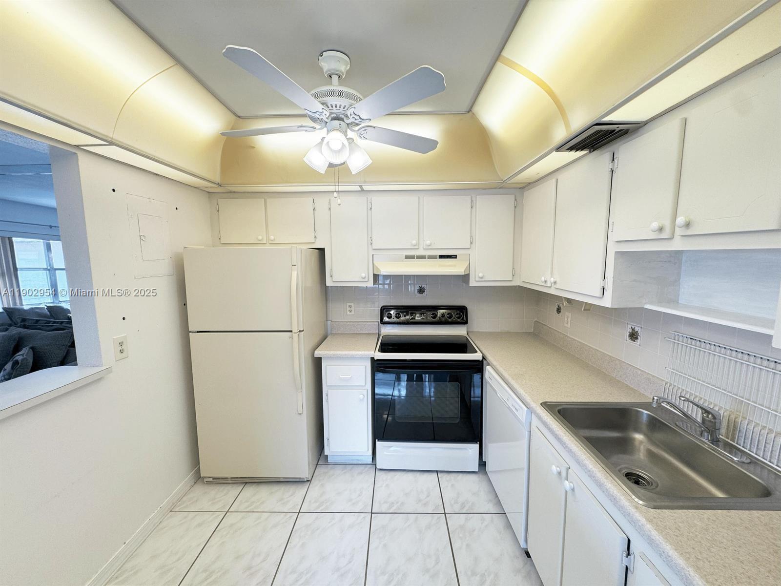 379 Saxony Lane, Unit 379 Delray Beach, FL 33446 - Photo 1 of 16 a kitchen with stainless steel appliances a refrigerator sink and cabinets