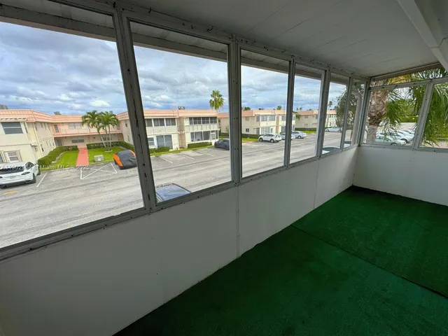 a view of an empty room with a large window