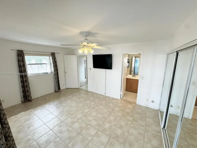 a view of an empty room with a fireplace