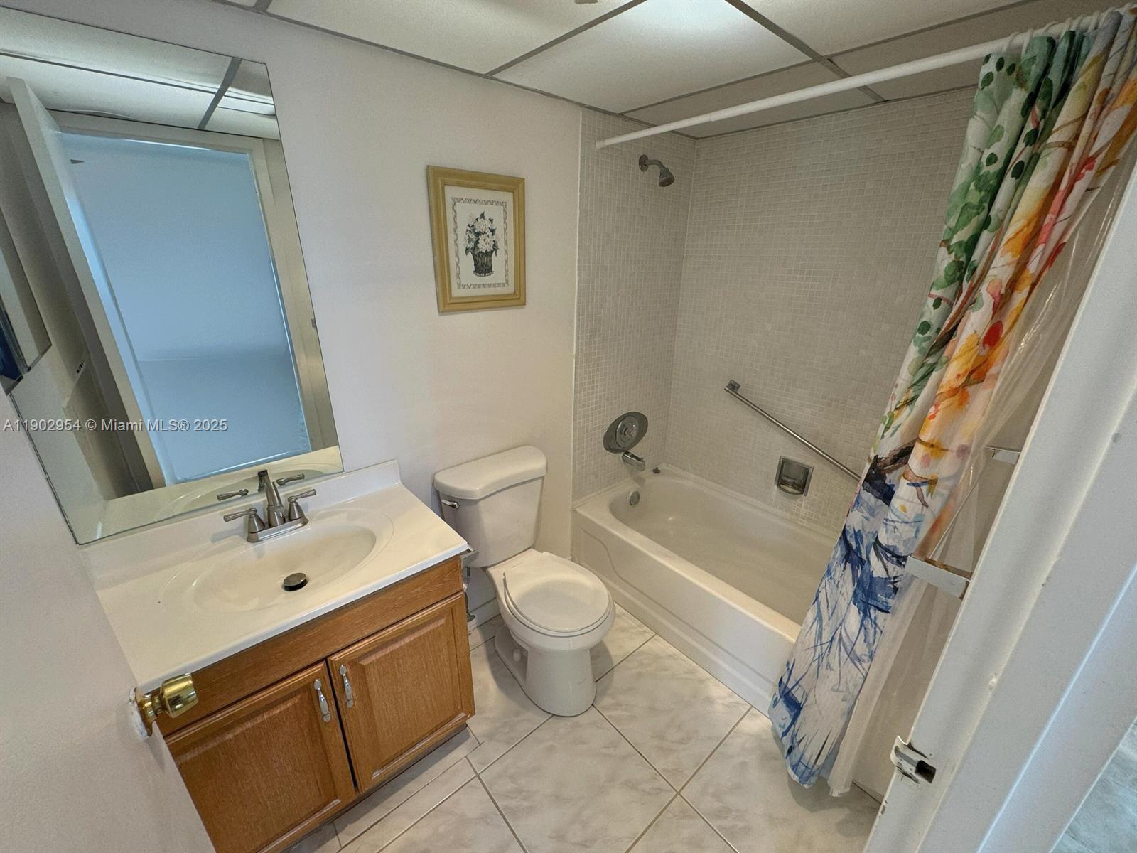 379 Saxony Lane, Unit 379 Delray Beach, FL 33446 - Photo 9 of 16 a bathroom with a sink a toilet and shower