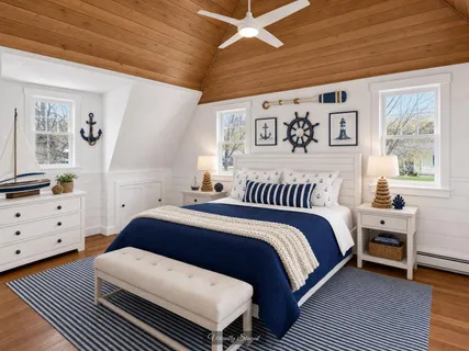 a spacious bedroom with a large bed and a window