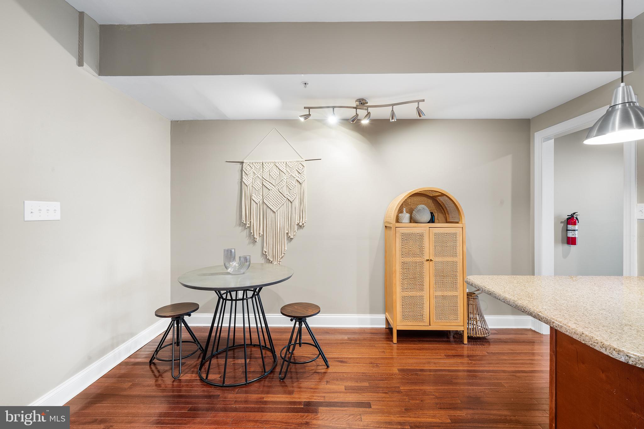 1927 Poplar Street, Unit B Philadelphia, PA 19130 - Photo 11 of 27 a view of a room with wooden floor and furniture