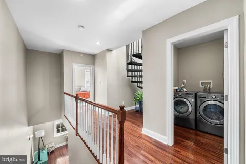 a view of a hallway with washer and dryer