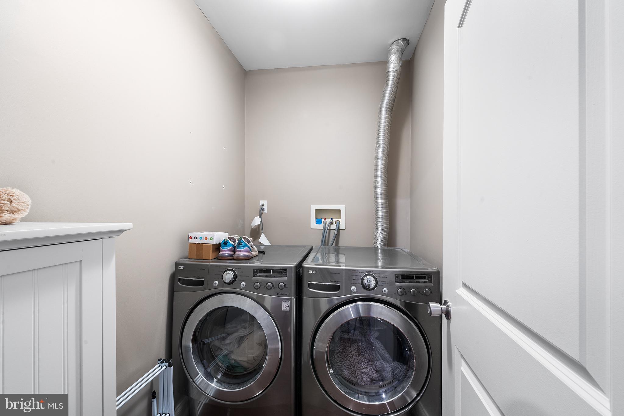 1927 Poplar Street, Unit B Philadelphia, PA 19130 - Photo 21 of 27 a utility room with dryer and washer