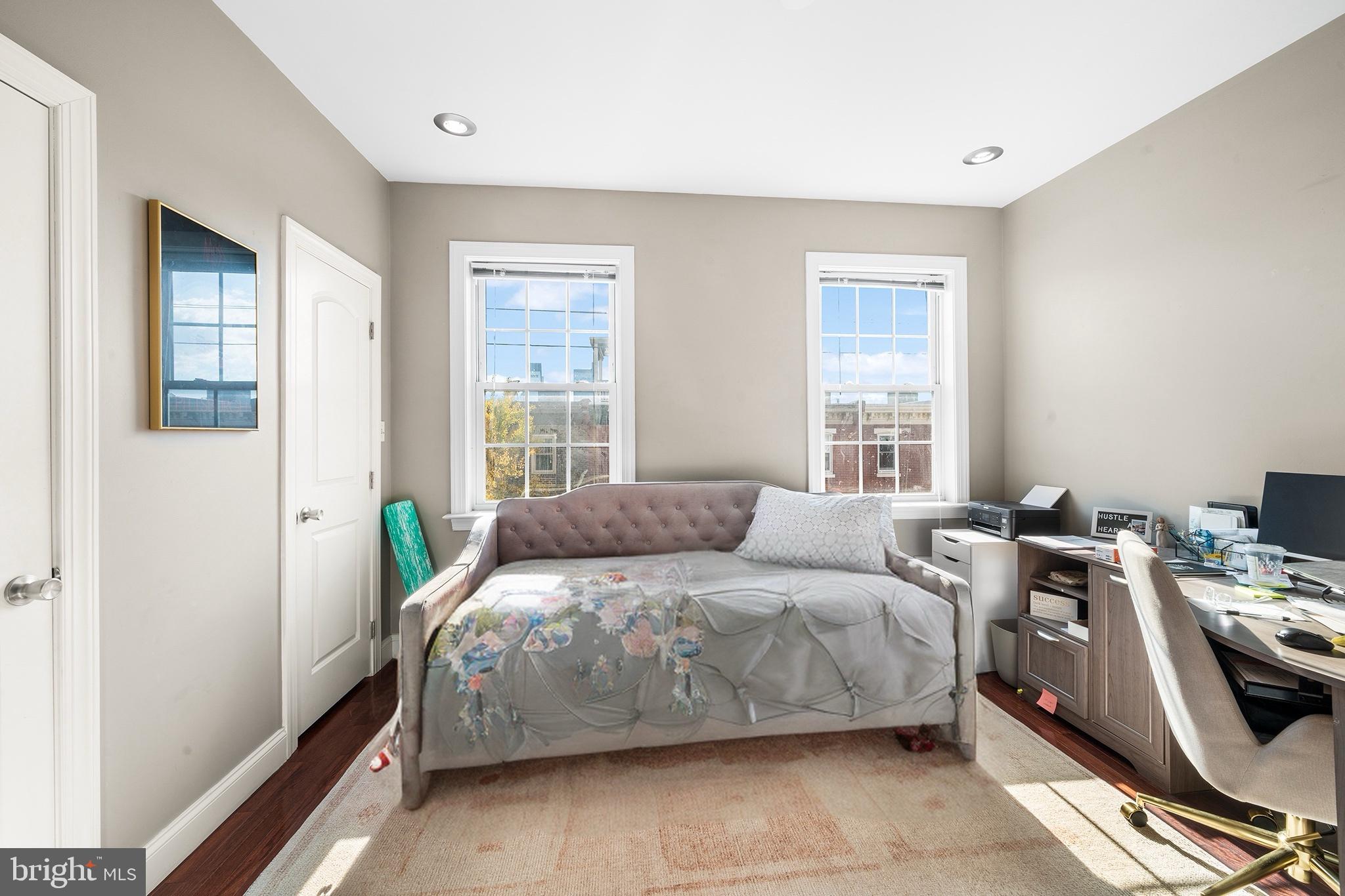 1927 Poplar Street, Unit B Philadelphia, PA 19130 - Photo 24 of 27 a bedroom with a bed and a window