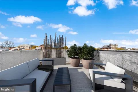 a view of roof deck with seating space