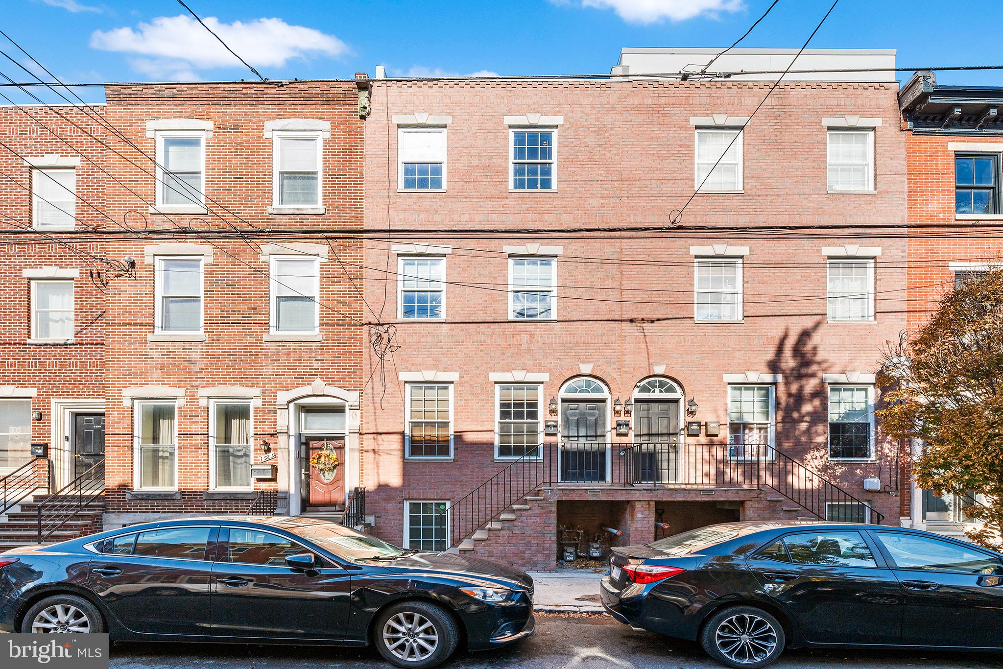 1927 Poplar Street, Unit B Philadelphia, PA 19130 - Photo 27 of 27 a front view of a building with cars parked