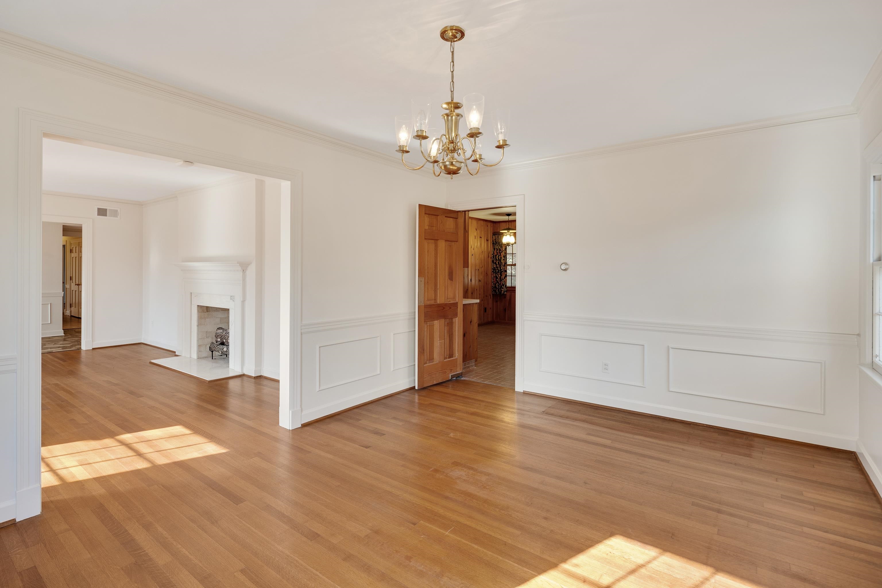 685 South Perkins Road Memphis, TN 38117 - Photo 11 of 40 a view of an empty room with wooden floor and a ceiling fan