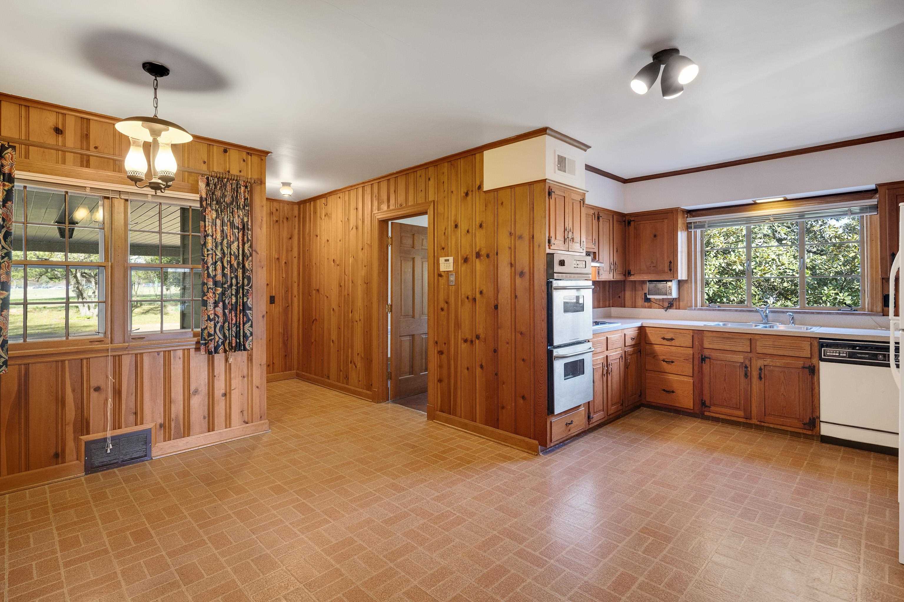 685 South Perkins Road Memphis, TN 38117 - Photo 12 of 40 a large kitchen with a large window and stainless steel appliances