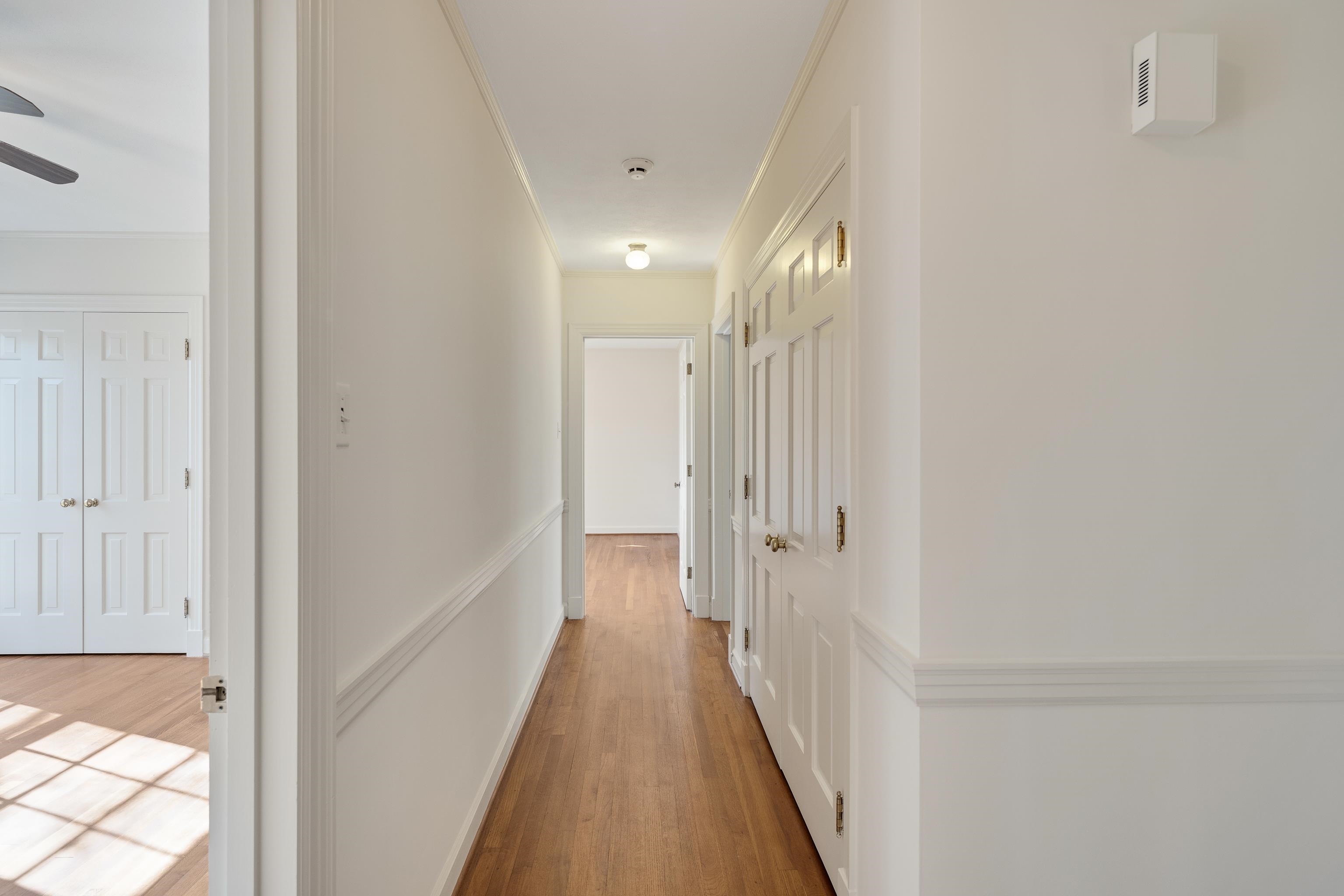 685 South Perkins Road Memphis, TN 38117 - Photo 22 of 40 a view of a hallway with wooden floor and closet