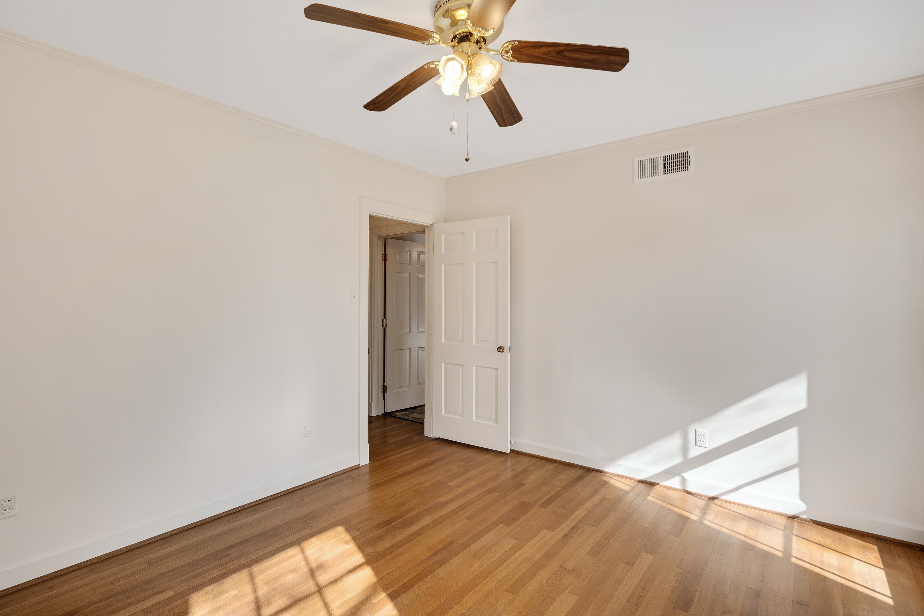 685 South Perkins Road Memphis, TN 38117 - Photo 24 of 40 a view of a room with wooden floor and ceiling fan