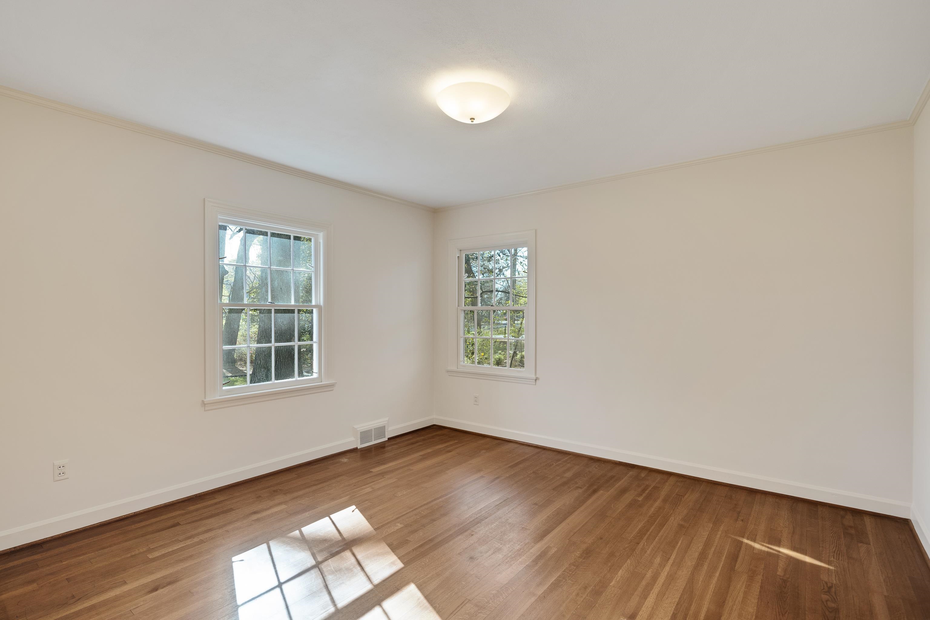 685 South Perkins Road Memphis, TN 38117 - Photo 26 of 40 an empty room with wooden floor and windows