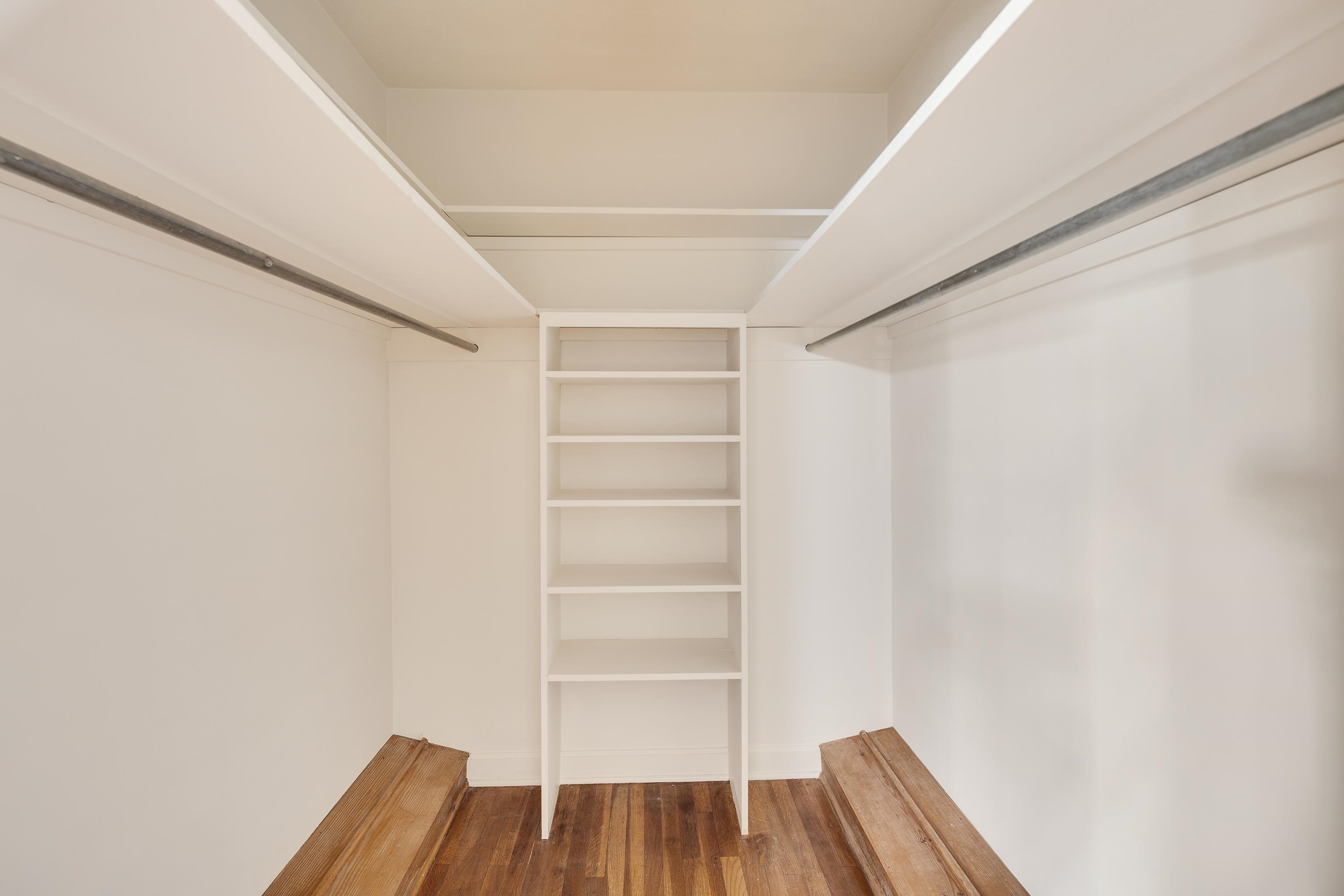 685 South Perkins Road Memphis, TN 38117 - Photo 30 of 40 a view of walk in closet with wooden floor