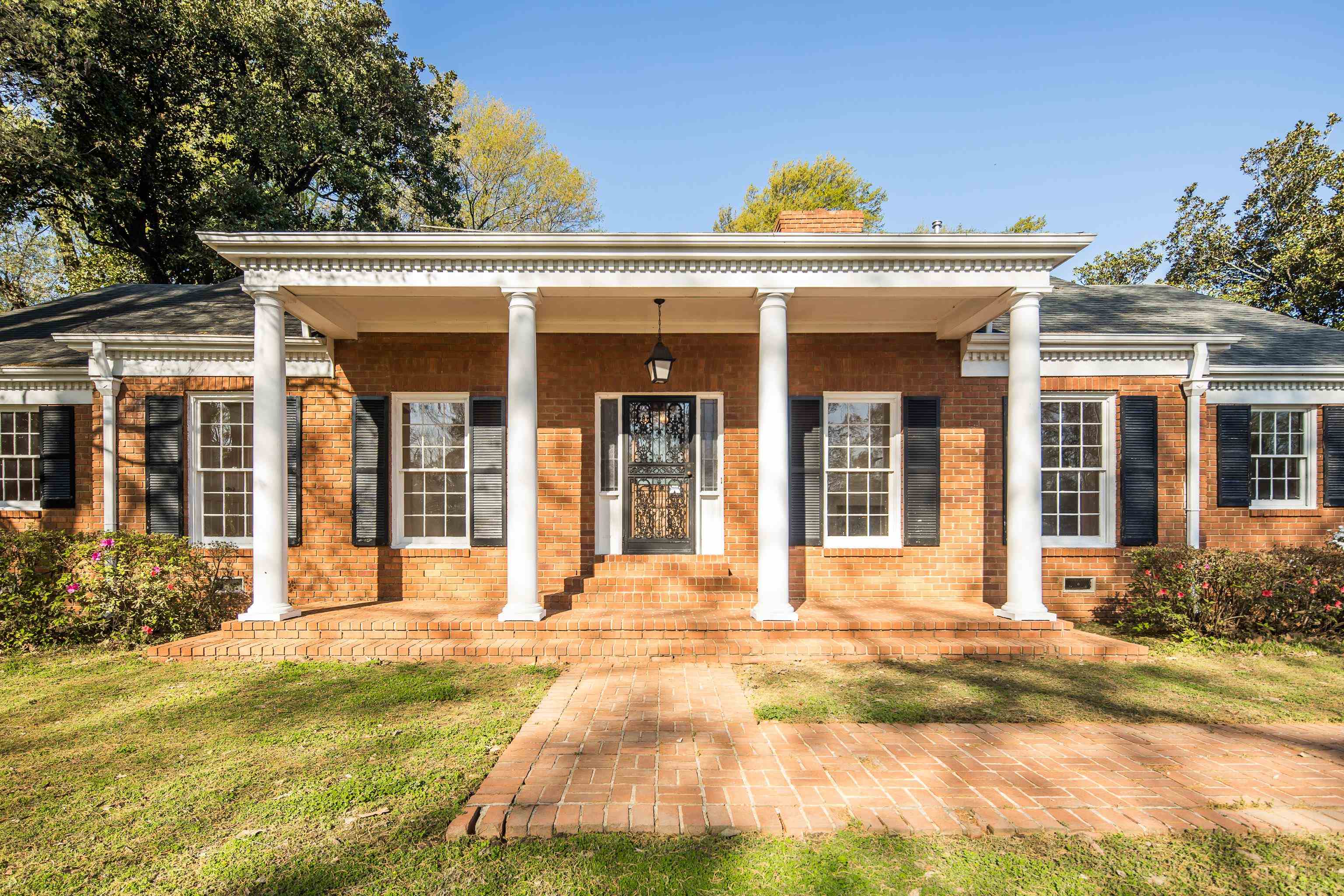 685 South Perkins Road Memphis, TN 38117 - Photo 3 of 40 a view of a white building with large windows and a yard
