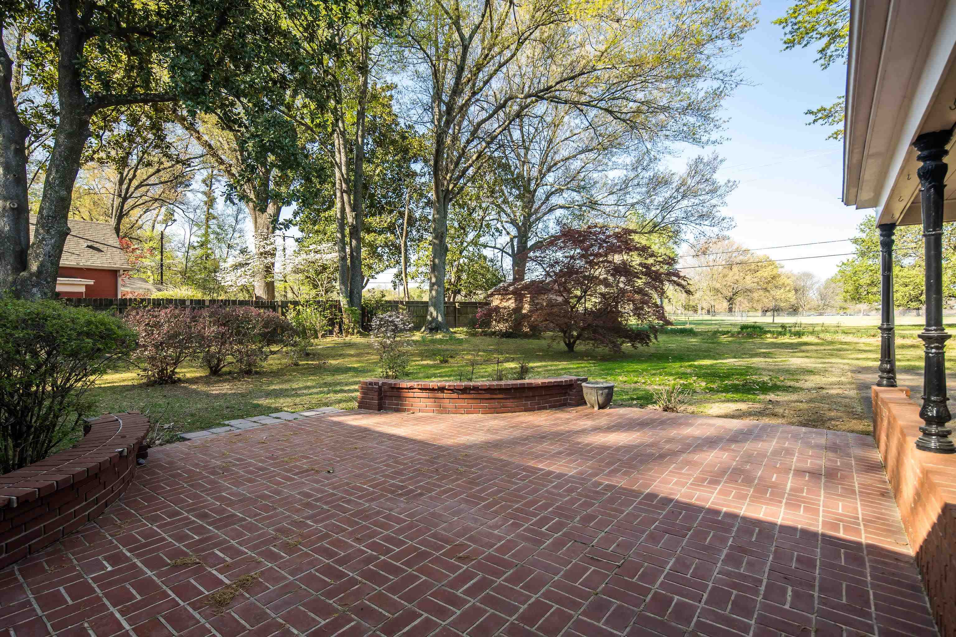 685 South Perkins Road Memphis, TN 38117 - Photo 34 of 40 a view of a lake with a yard and a large tree